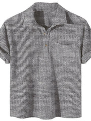 Dark gray ribbed polo shirt with rolled sleeves and chest pocket