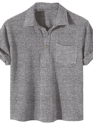 Dark gray ribbed polo shirt with rolled sleeves and chest pocket