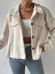 Beige teddy bear textured shacket with patch pockets and button front.