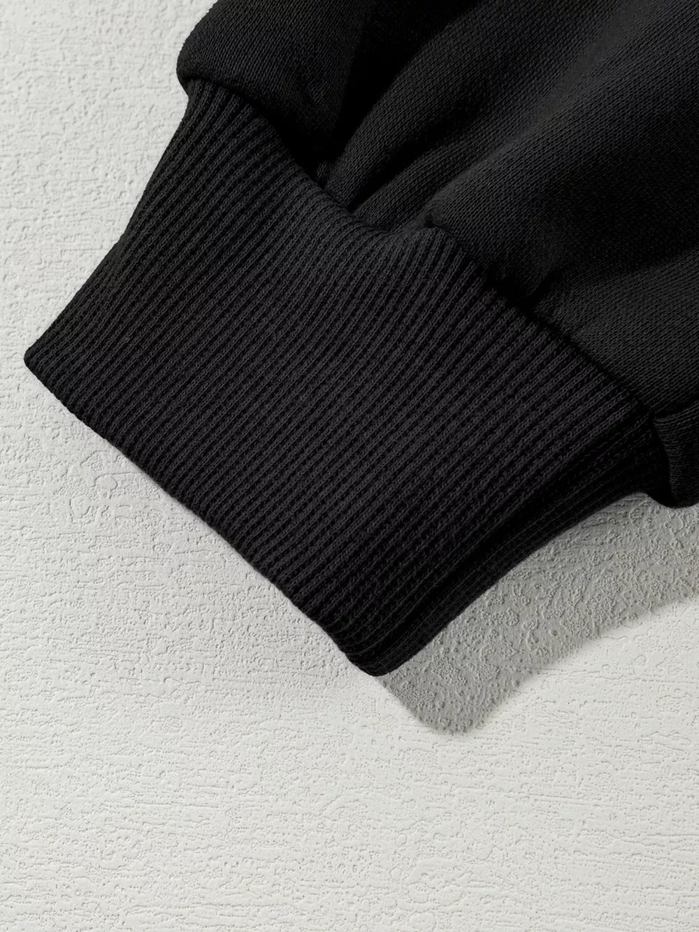Black cotton joggers with ribbed cuff detail
