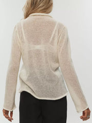 Sheer mock neck knit sweater in apricot with a relaxed fit and long sleeves.