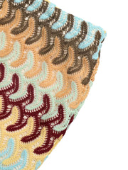 Crochet mini skirt with colorful chevron pattern and open knit detail.