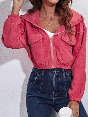 Cropped corduroy hooded jacket in hot pink with zip front and chest pockets.