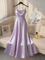 Light purple satin cami dress with pearl-embellished straps and a cowl neckline.