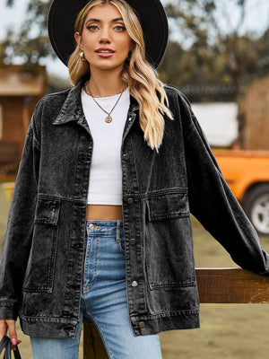 Oversized dark gray denim trucker jacket with collared neck and chest pockets.