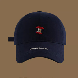 Navy blue baseball cap with apple core embroidery and "YOUTH DAYOFF" text.