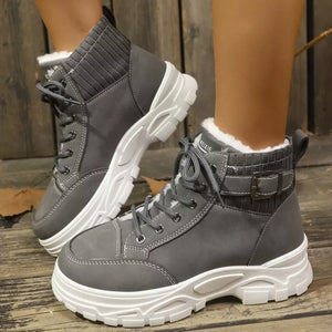 Dark gray lace-up boots with plush accents and knit cuffs.