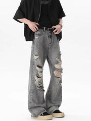 Men's light gray distressed wide-leg jeans with frayed rips.