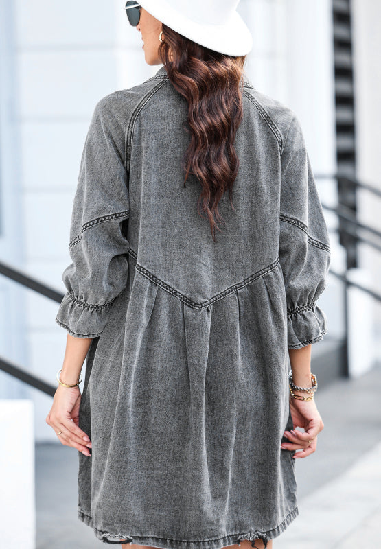 Gray denim A-line shirtdress with ruffled cuffs and buttoned front detail.