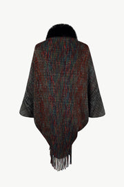 Textured knit cape with faux fur collar and fringe hem, featuring a multicolor stripe pattern.