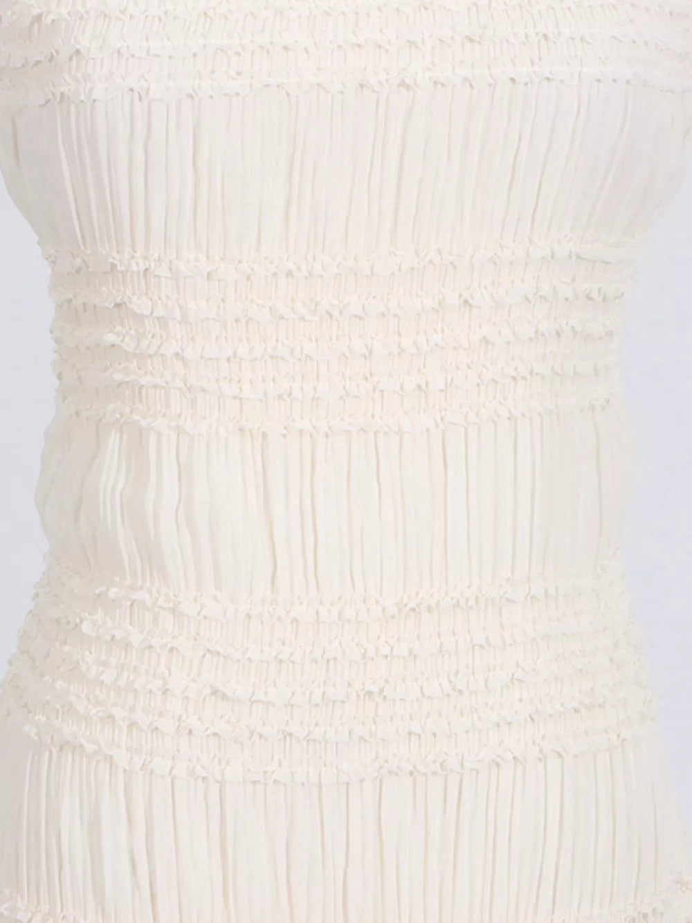 Textured halter neck maxi gown in ivory with smocked bodice detail.