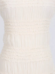 Textured halter neck maxi gown in ivory with smocked bodice detail.