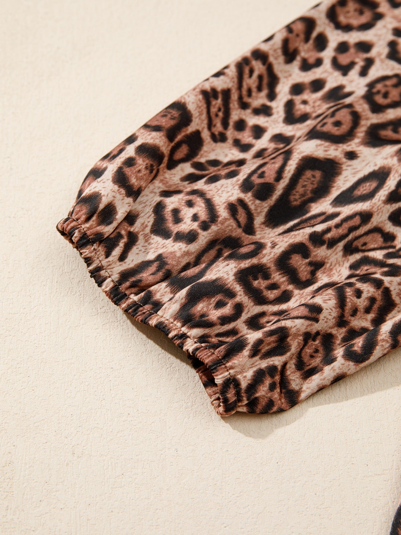 Leopard print blouse with elasticated puff sleeve detail.