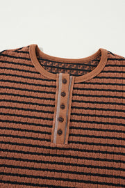 Textured henley knit top in caramel with black stripes and a button placket.