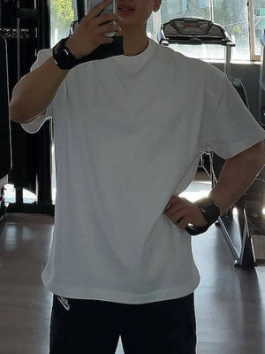 Oversized white t-shirt with crew neck and short sleeves, casual basic style.