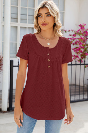 Rust eyelet yoke gathered henley shirt with button detail and scoop neck.