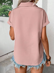 Dusty pink polyester button-down shirt with cuffed short sleeves and a curved hem.