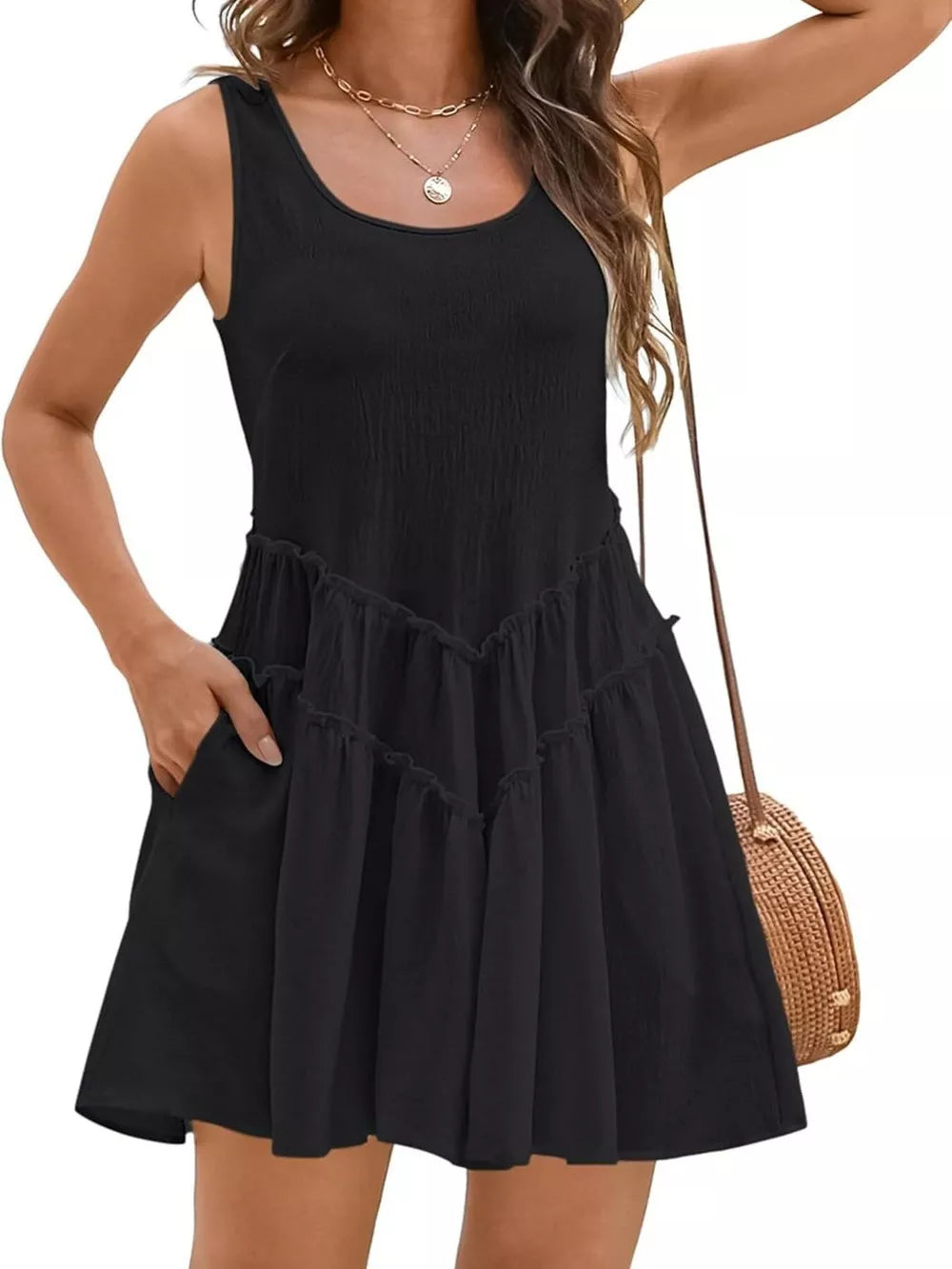 Black frill tiered mini dress with scoop neck, sleeveless, and pockets.