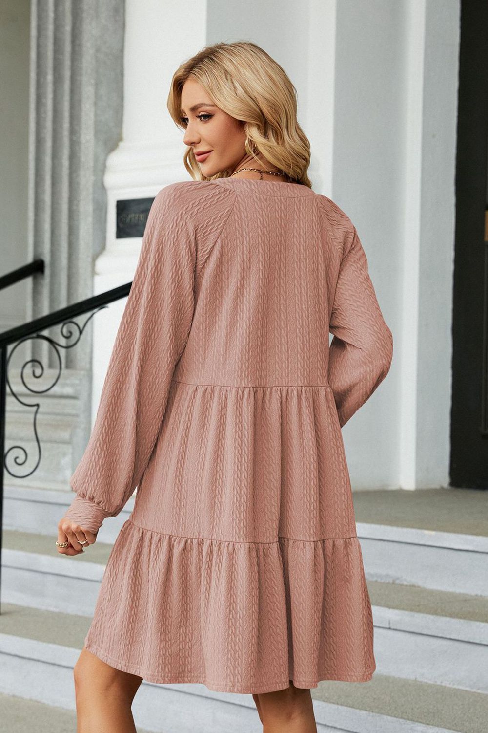 Dusty Pink textured babydoll mini dress with voluminous sleeves and tiered skirt.