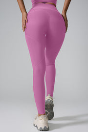 Pink purple ribbed contour leggings with seamless detailing and a high waist.
