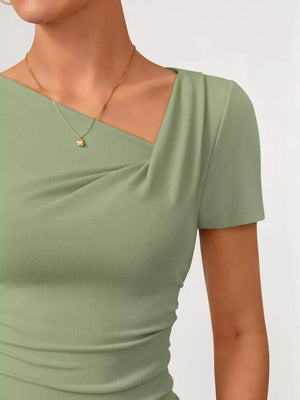 Green asymmetrical maternity t-shirt with draped neckline and short sleeves.
