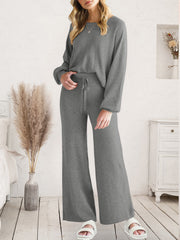 Dark gray acrylic loungewear set with crew neck top and wide-leg pants with drawstring waist