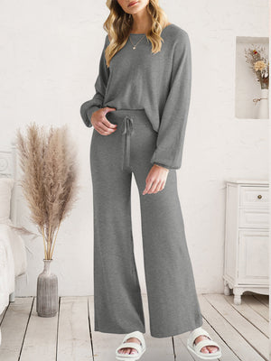 Dark gray acrylic loungewear set with crew neck top and wide-leg pants with drawstring waist