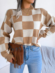 Checkerboard knit mock neck pullover in camel and ivory acrylic with long sleeves.