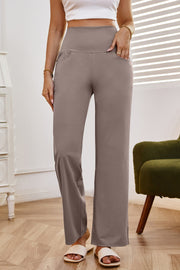 High-waisted flare leg trousers in tan with pockets, styled casually.