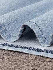 Light wash denim mini dress with visible stitching detail