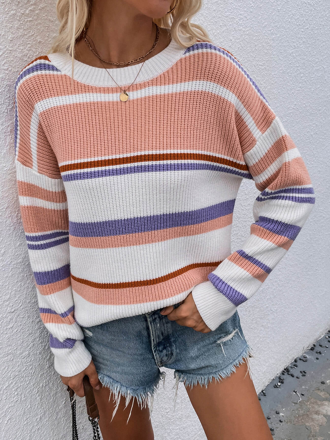 Pastel stripe crewneck knit sweater with pink, white, purple, and brown stripes.