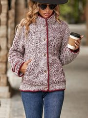 Sherpa jacket with crimson piping and button front, in a mottled burgundy color.