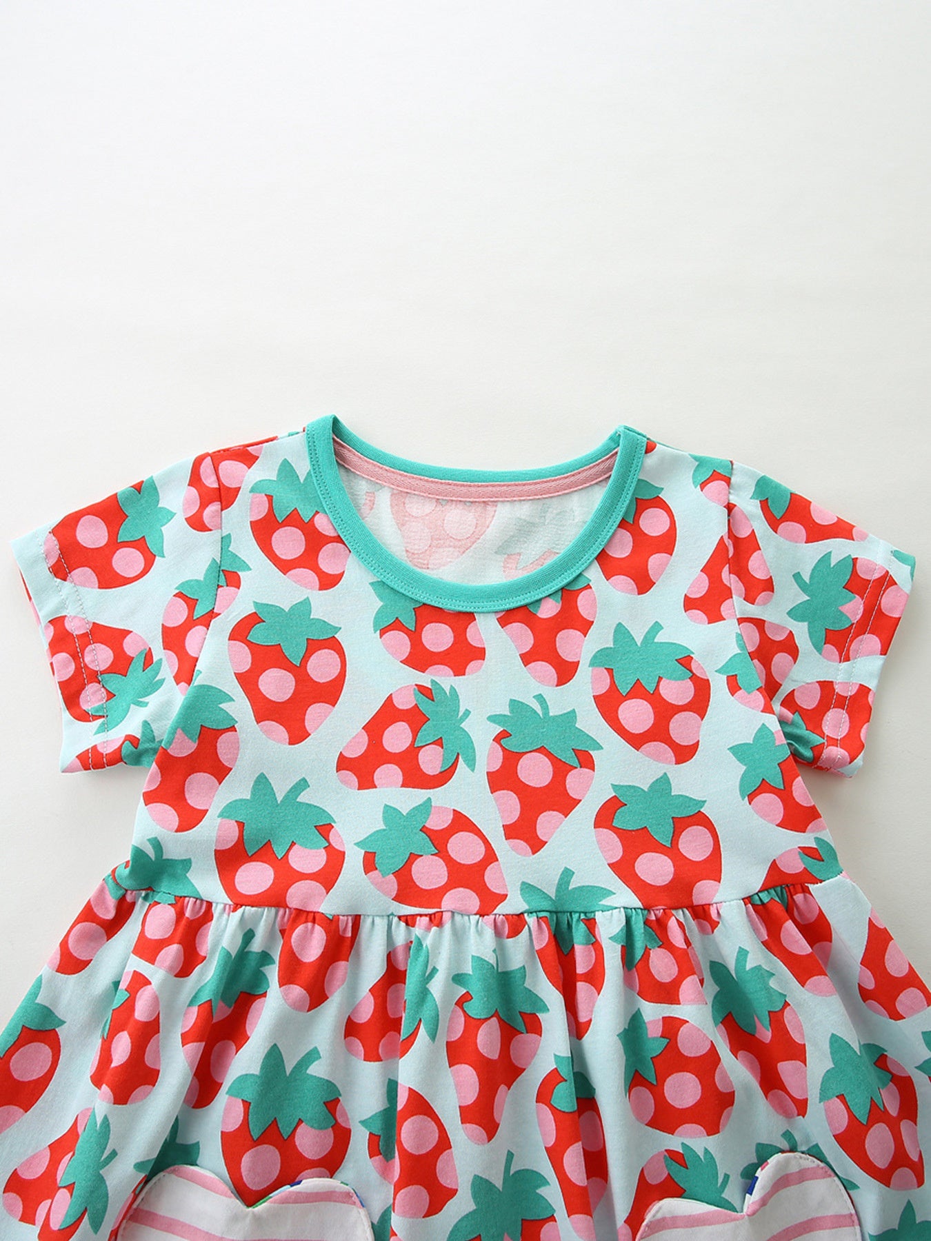 Baby girls' cotton dress with a light blue strawberry print, short sleeves, and a ruffled hem.