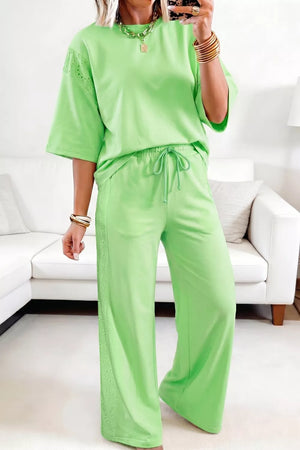 Embroidered eyelet cotton two-piece set with drawstring pants and short sleeves in lime green.