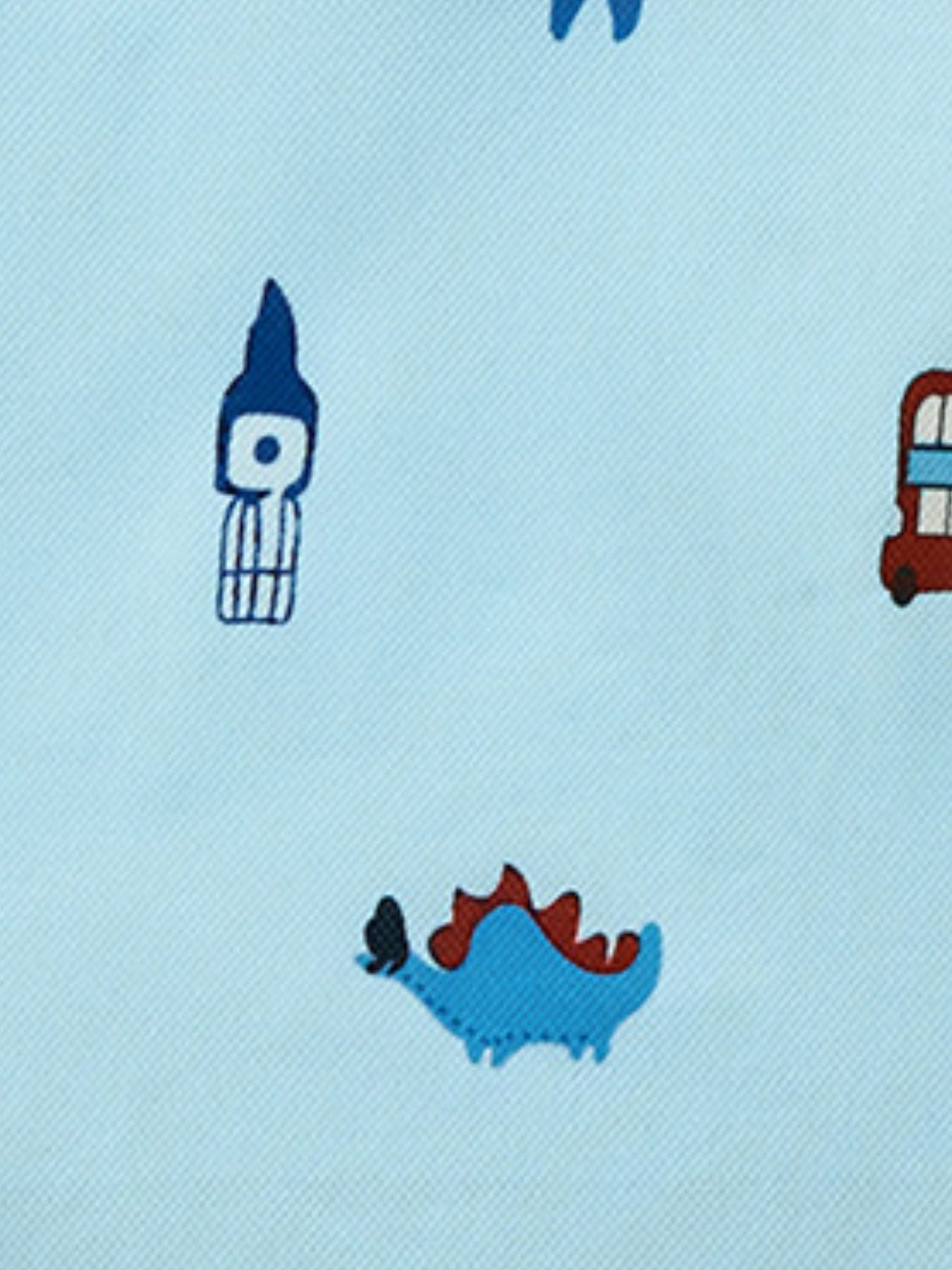 Light blue polo shirt with cartoon dinosaur, Big Ben, and bus print.