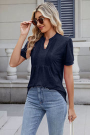 Dark navy pleated yoke henley tee with keyhole neckline and short sleeves.