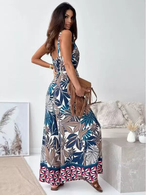 Paisley patterned tied wide-leg romper in Peacock Blue with a belted waist and flowing wide legs.