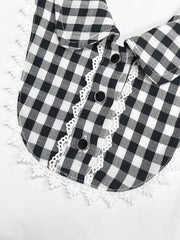 Black and white gingham maternity shirt with lace trim collar and decorative buttons.