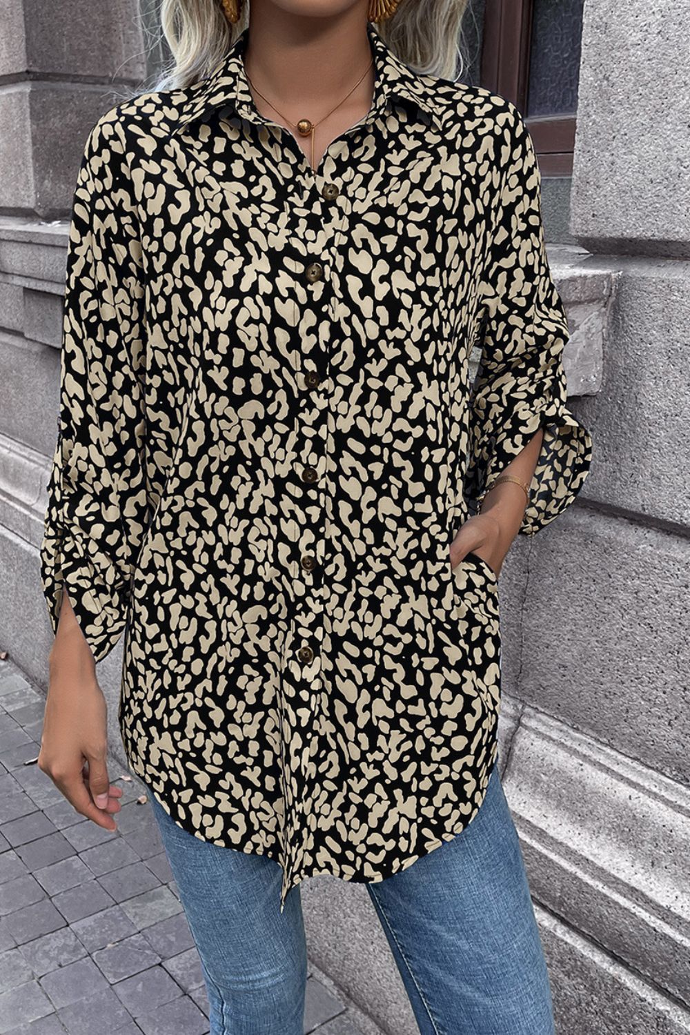 Black abstract spot print oversized shirt with button front and rolled sleeves.