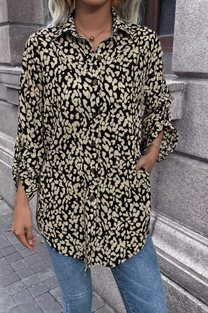 Black abstract spot print oversized shirt with button front and rolled sleeves.