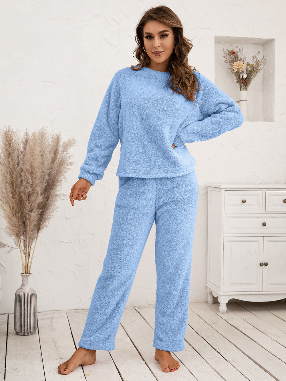 Plush raglan sleeve lounge set in light blue, featuring a crewneck sweatshirt and relaxed fit pants.