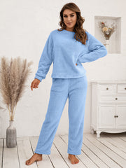 Plush raglan sleeve lounge set in light blue, featuring a crewneck sweatshirt and relaxed fit pants.