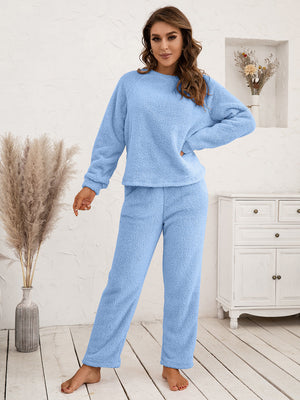 Plush raglan sleeve lounge set in light blue, featuring a crewneck sweatshirt and relaxed fit pants.