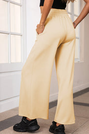 Pastel Yellow palazzo joggers with center seam detail and elastic waist.