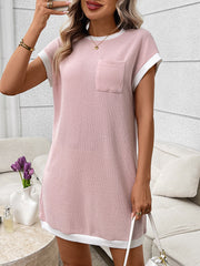 Pink ribbed knit mini dress with white trim and a chest pocket.