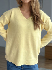 Relaxed-fit light yellow v-neck knit sweater with ribbed hem and cuffs