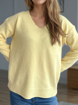 Relaxed-fit light yellow v-neck knit sweater with ribbed hem and cuffs