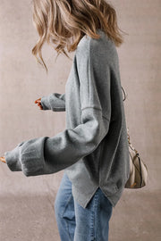 Relaxed fit dark gray ribbed sweatshirt with crewneck and cuffed sleeves.