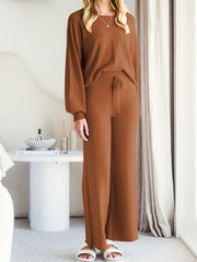 Caramel acrylic knit loungewear set with wide-leg pants and a crewneck top.