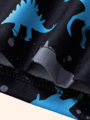 Toddler two-piece set with blue dinosaur silhouettes on black fabric.
